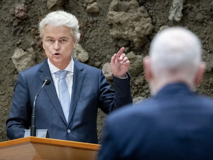 The Netherlands' far right PVV party leader Geert Wilders (L) addresses a speech next to l
