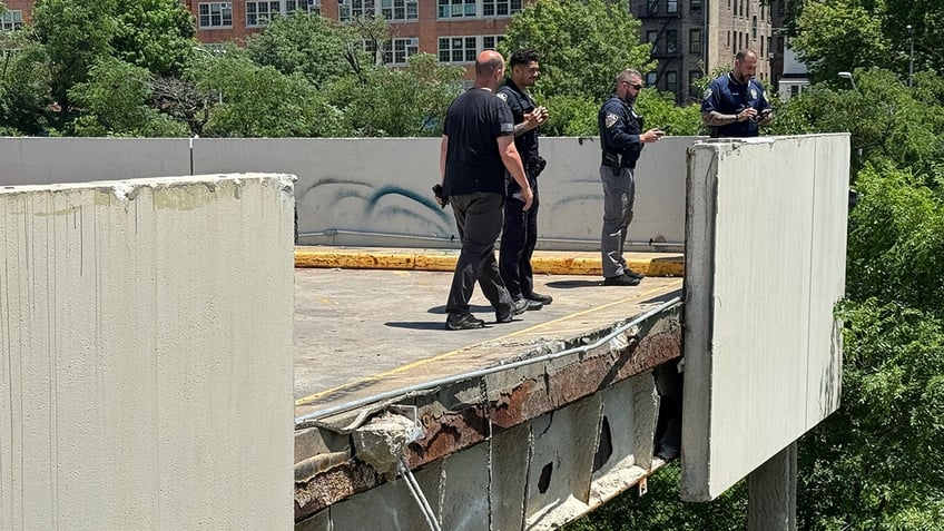 NYPD looks over edge of crashed Target parking garage