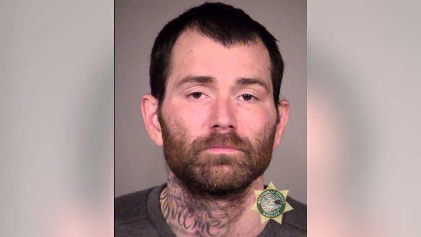 portland fugitive fished out of pond after escape lands him in mud up to armpits