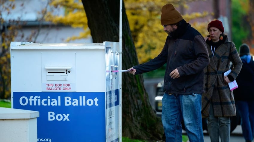 Voters cast their ballots at official ballot boxes on November 8, 2022 in Portland, Oregon