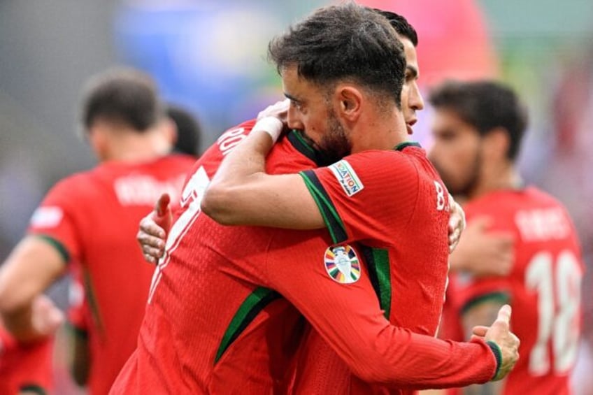 Bruno Fernandes (R) was set up for Portugal's third goal by Cristiano Ronaldo