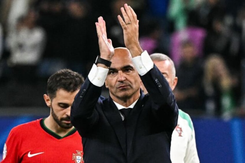 Portugal coach Roberto Martinez said his team were eliminated with "pride" and would come