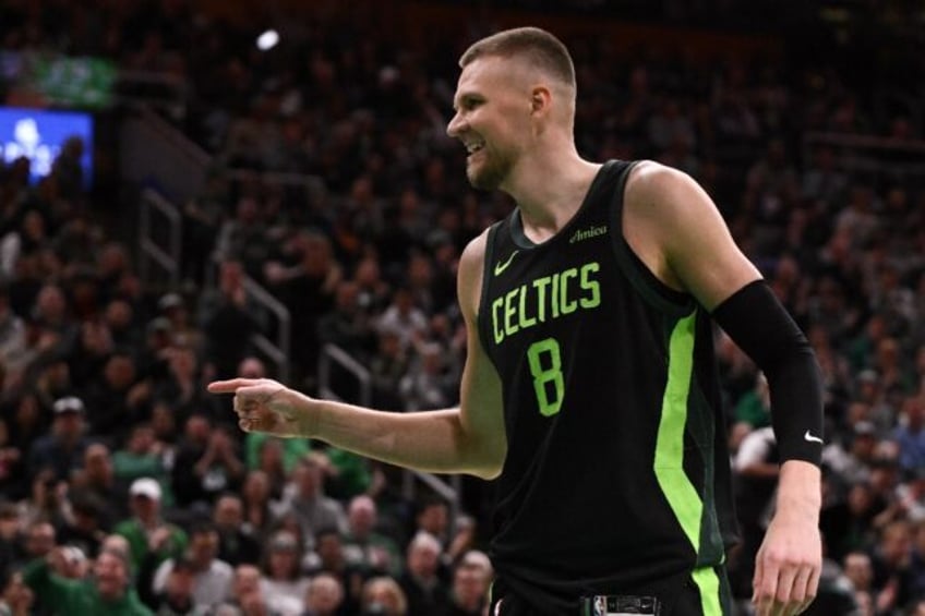 Kristaps Porzingis of the Boston Celtics celebrates after a basket in his return for the N