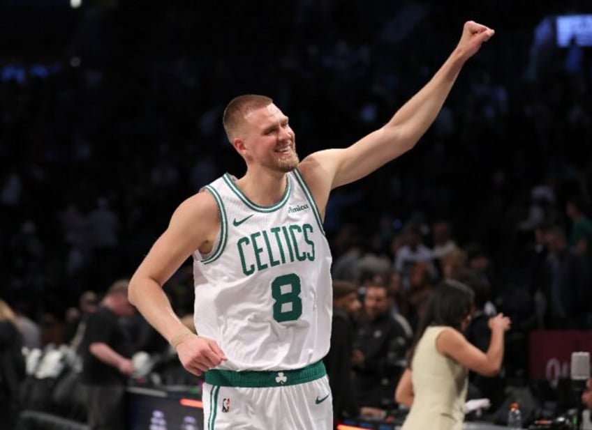 Latvian center Kristaps Porzingis celebrates an NBA victory by the Boston Celtics at Brook