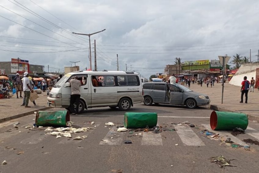 Protesters blockade a road during a demonstration against the government in Mozambique's c