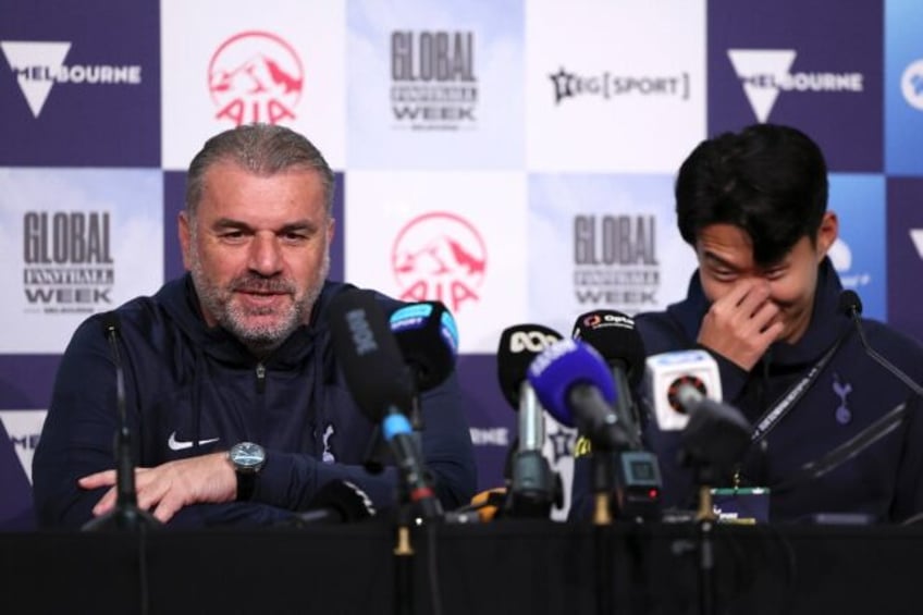 Tottenham Hotspur coach Ange Postecoglou (L) and player Son Heung-min attend a press confe