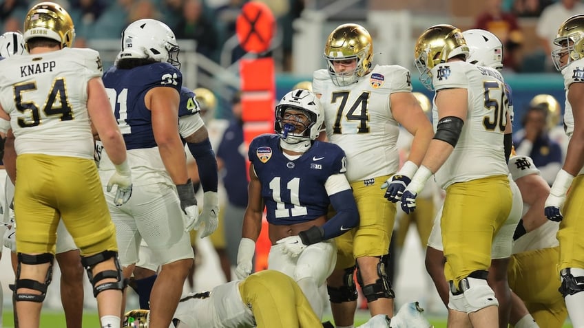 Penn State defensive end Abdul Carter (11) celebrates a tackle.