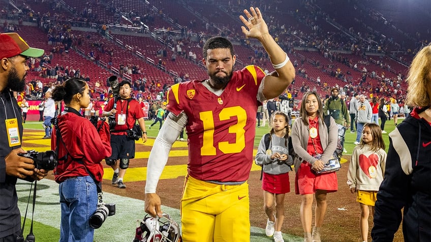 Caleb Williams walks off the field