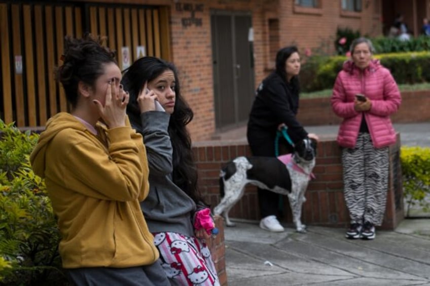 Residents of the Pasadena neighborhood remain on the street after an earthquake in Bogota
