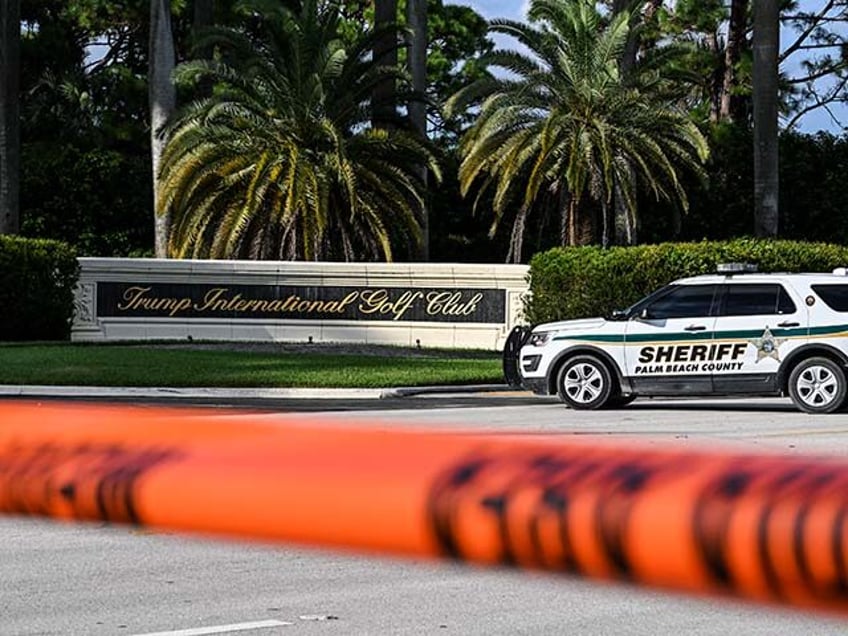 A Sherrif block the street outside the Trump International Golf Club in West Palm Beach, F