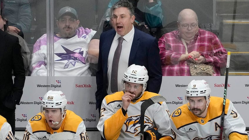 Andrew Brunette yells from behind the bench