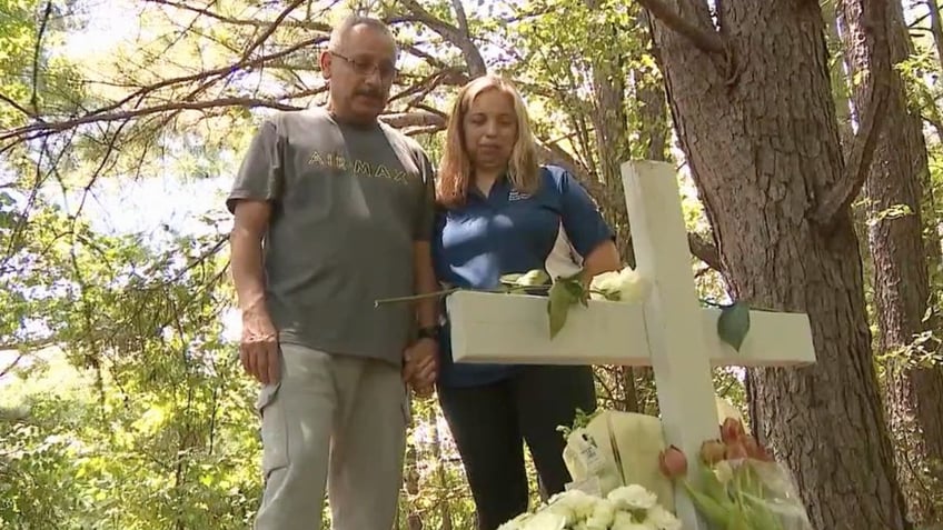 Deceased girls's parents at the site where she was found dead