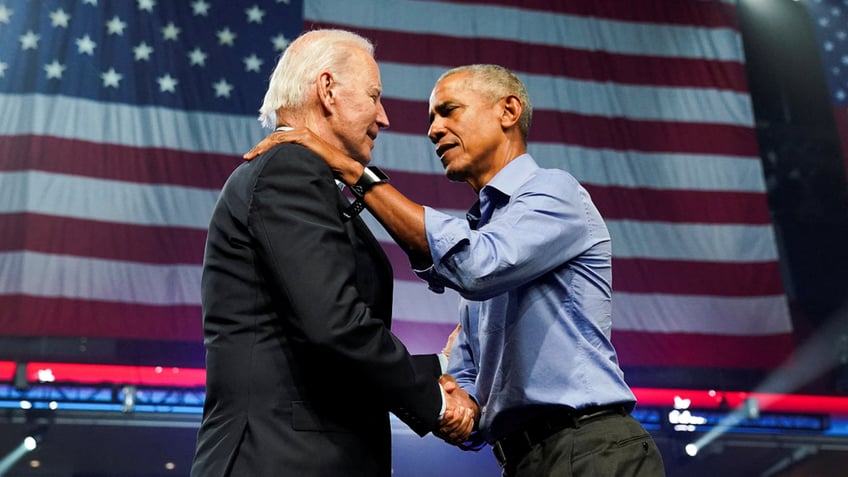 Obama with hand on Biden shoulder 