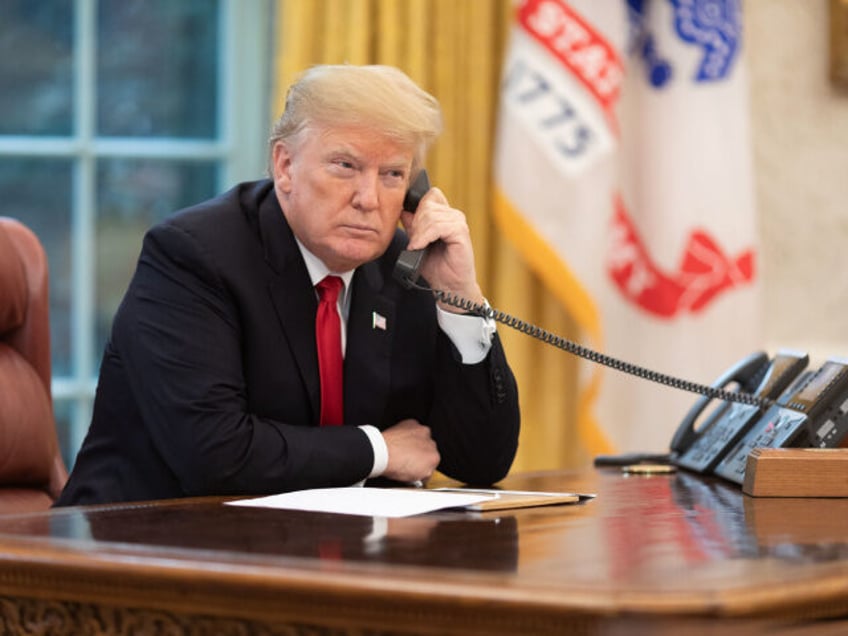 President Donald J. Trump speaks on the phone in the Oval Office Wednesday, Nov. 14, 2018,