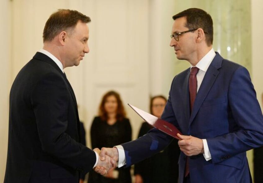 president taps polands outgoing prime minister to form new government despite lack of a majority