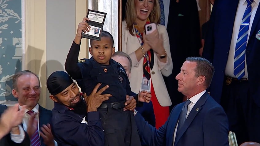 D.J. Daniel joined President Trump at the Joint Session—a 13-year-old battling cancer who has been sworn in as an honorary officer over 900 times.