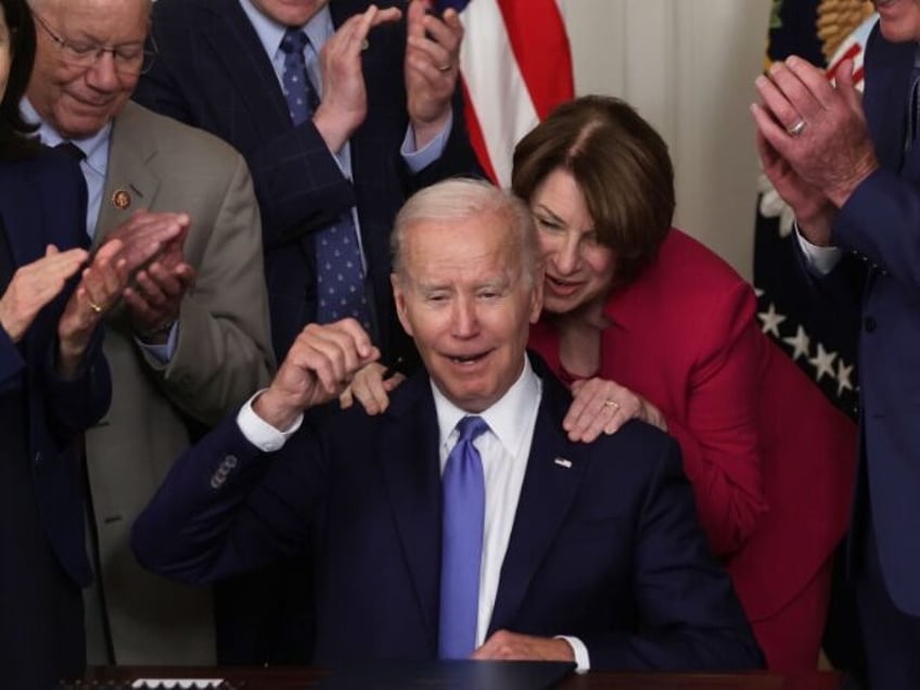WASHINGTON, DC - JUNE 16: U.S. Sen. Amy Klobuchar (D-MN) gives President Joe Biden a hug a