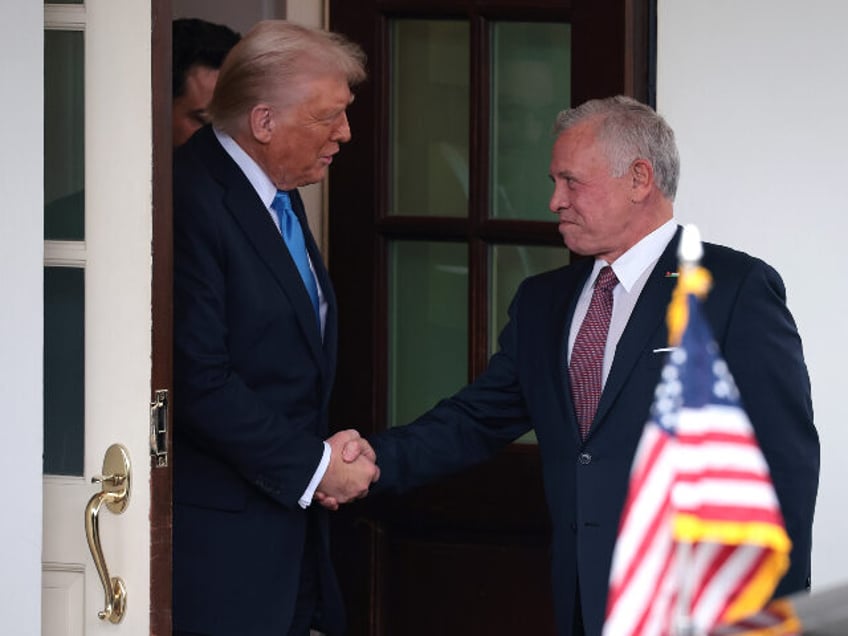 U.S. President Donald Trump shakes hands with Jordan’s King Abdullah II (R) as he depart