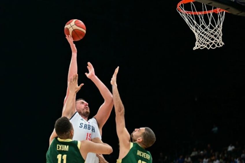 Nikola Jokic drives to the basket against Australia in an Olympics warmup game