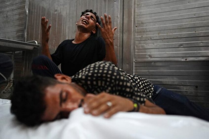 Palestinians in Khan Yunis, southern Gaza, mourn a relative killed during an Israeli strik