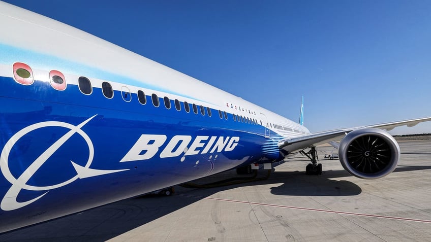 a view of the fuselage and one of the engines of a Boeing 777-9 jetliner