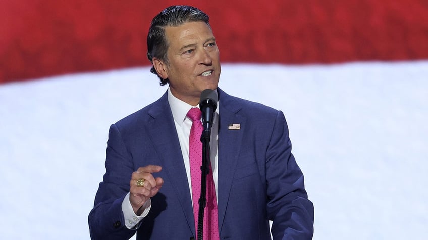 Ronny Jackson waves from the stage on Day 3 of the Republican National Convention