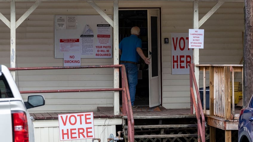 A voter enters Tuscaloosa County Ward 5, Montgomery Fire Department