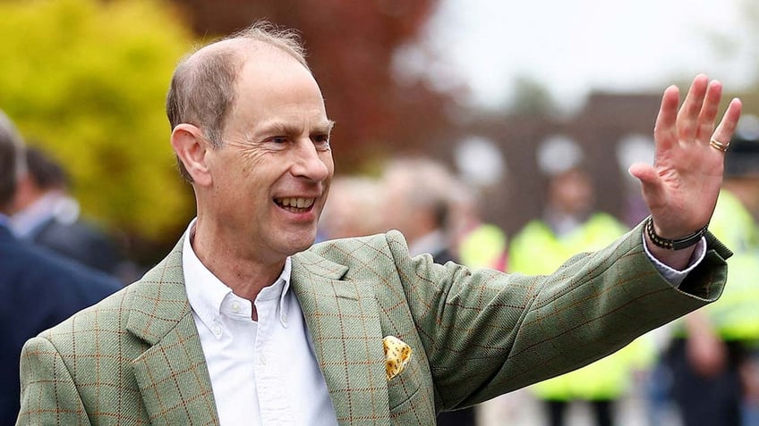 Britain's Prince William and Catherine, Princess of Wales greet well-wishers along the Long Walk outside Windsor Castle