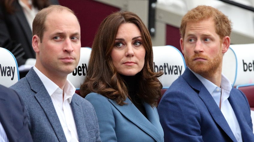 Prince William, Kate Middleton and Prince Harry all sitting together and looking serious