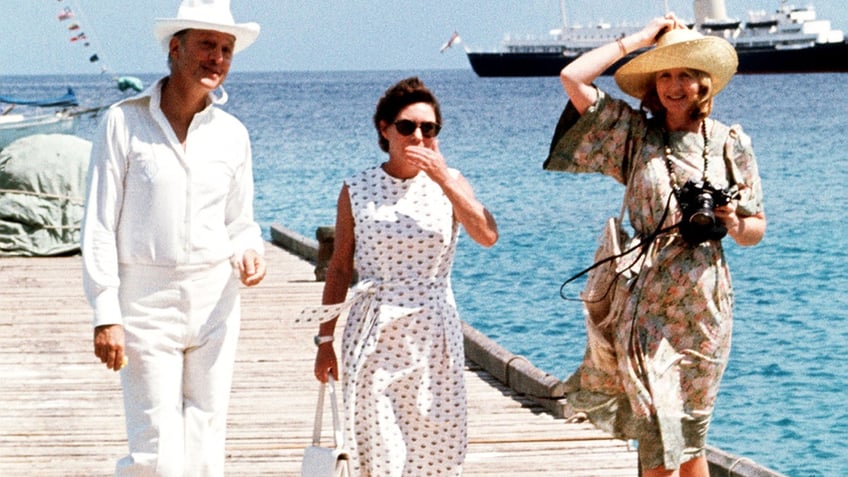 Princess Margaret walking with Colin Tennant and Lady Anne Glenconner