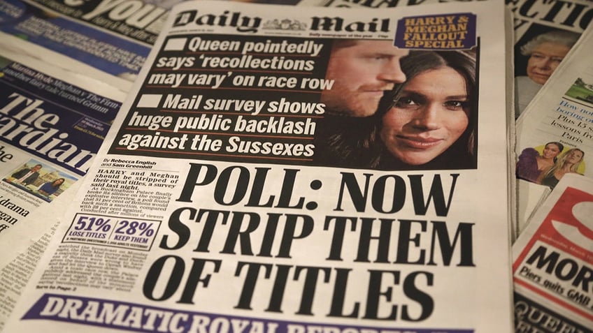 A newspaper showing Prince Harry and Meghan Markle.