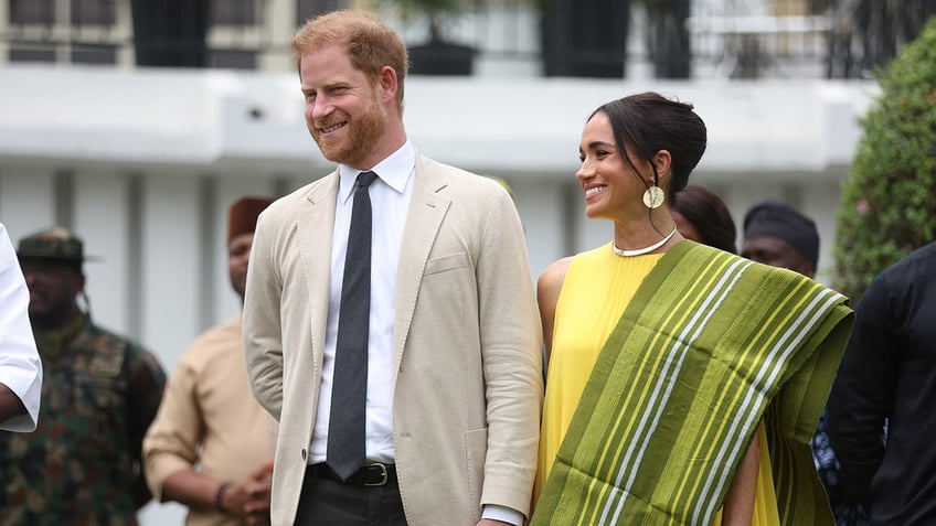 Prince Harry and Meghan Markle walking hand in hand