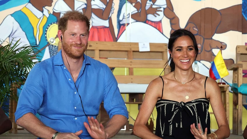 Prince Harry and Meghan Markle with drums