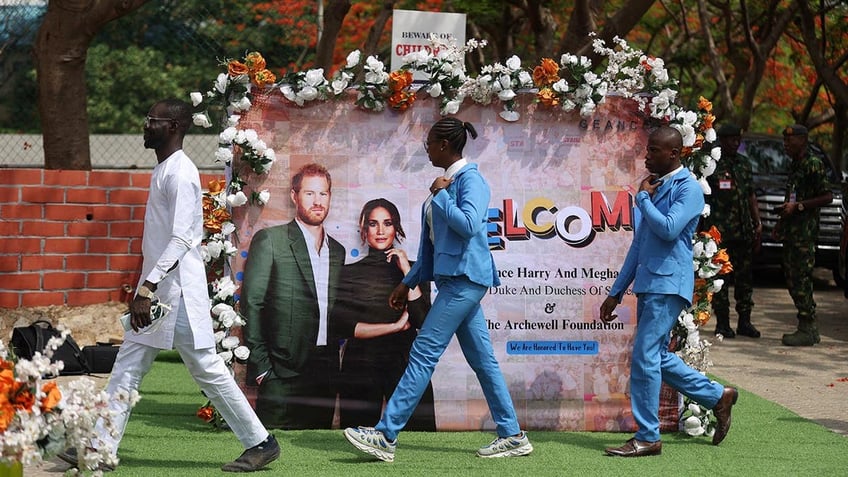 Prince Harry and Meghan are feted in a school in Nigeria