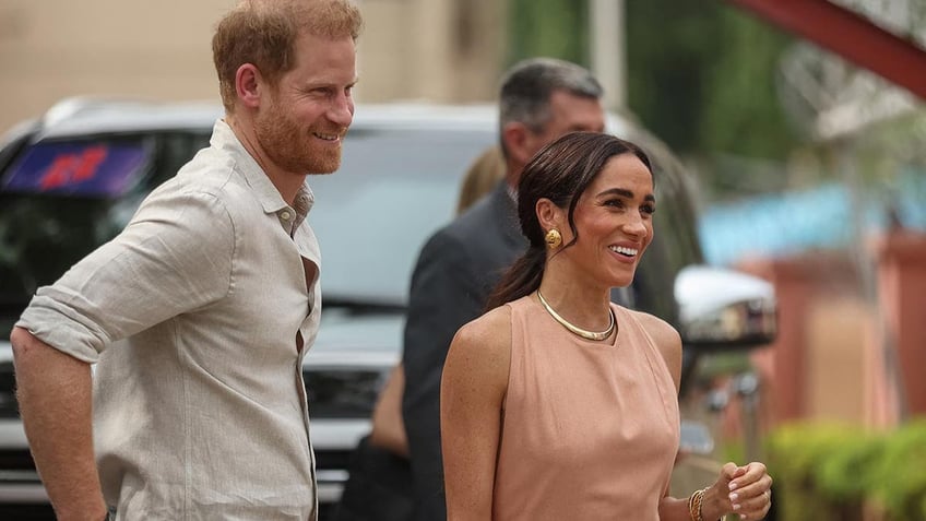 Prince Harry and Meghan are feted in a school in Nigeria