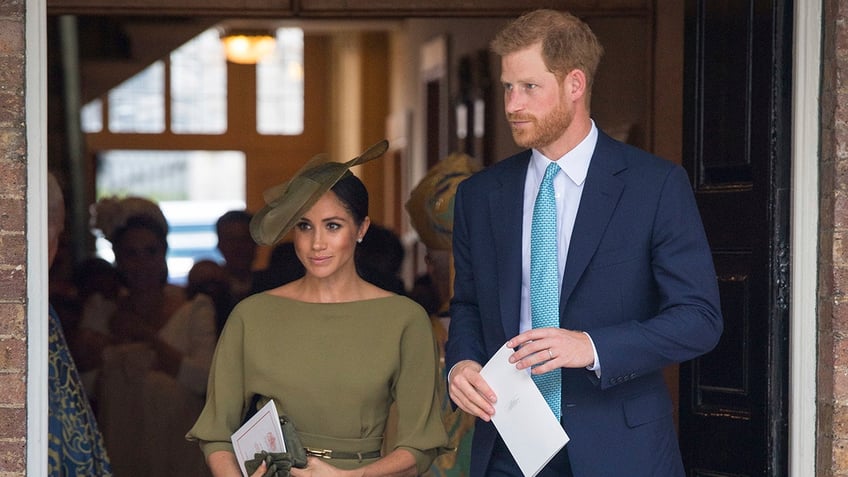 Britains Prince Harry and Meghan Duchess of Sussex leave after the christening service of Prince Louis at the Chapel Royal, St Jamess Palace, London, Monday, July 9, 2018. (Dominic Lipinski/Pool Photo via AP)