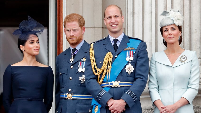 The British royal family standing together on the palace balcony