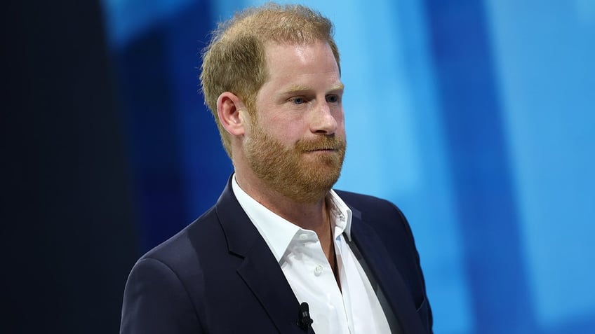 Prince Harry wears blue suit to speak at DealBook Summit.