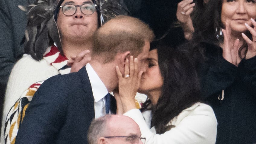 Meghan Markle kissing Prince Harry