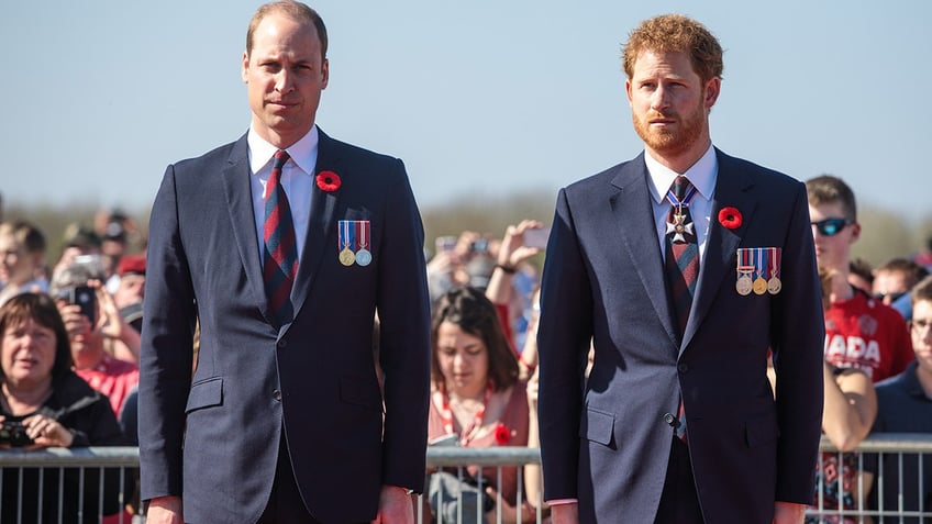 Prince William and Prince Harry wear blue suits