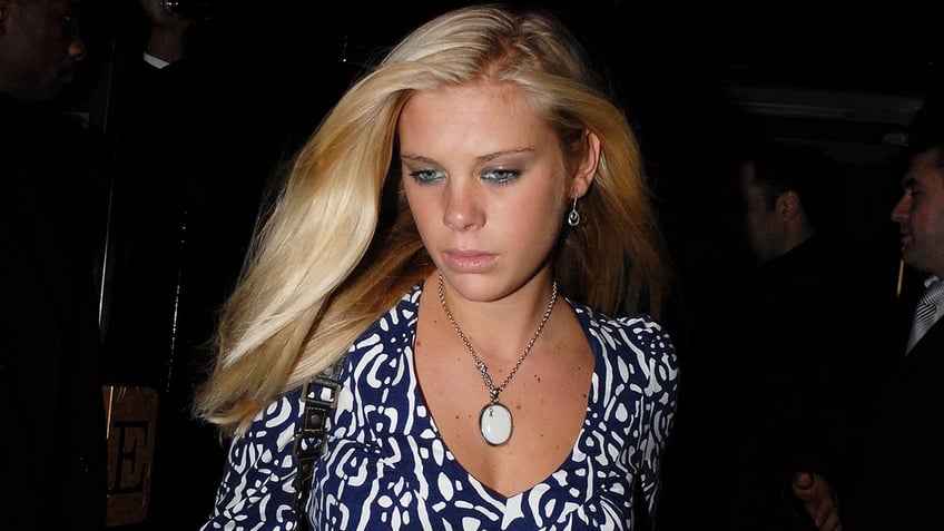 A close-up of Chelsy Davy wearing a patterned dress