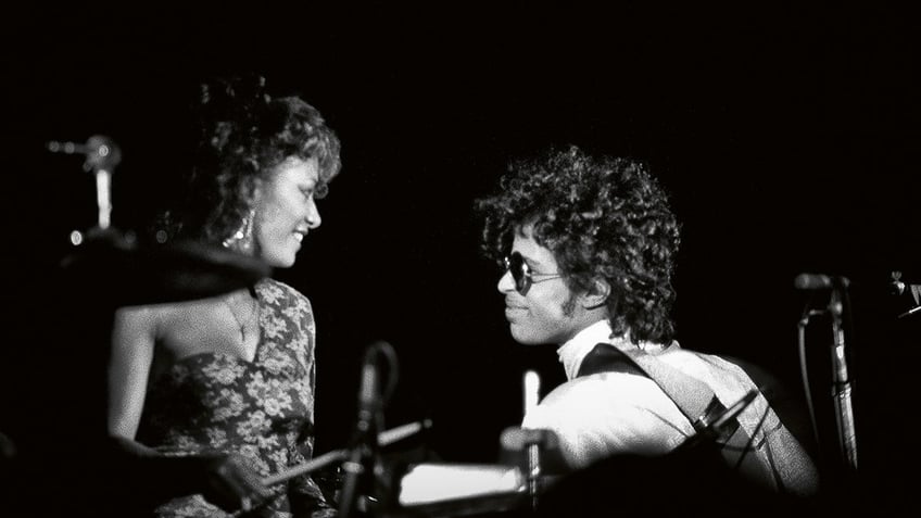 Prince admiring his drummer.