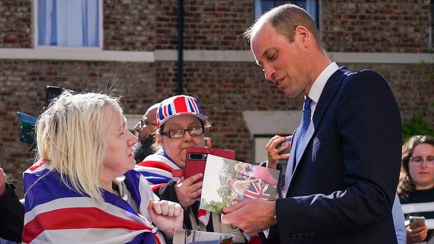 Prince William being greeted by well wishers
