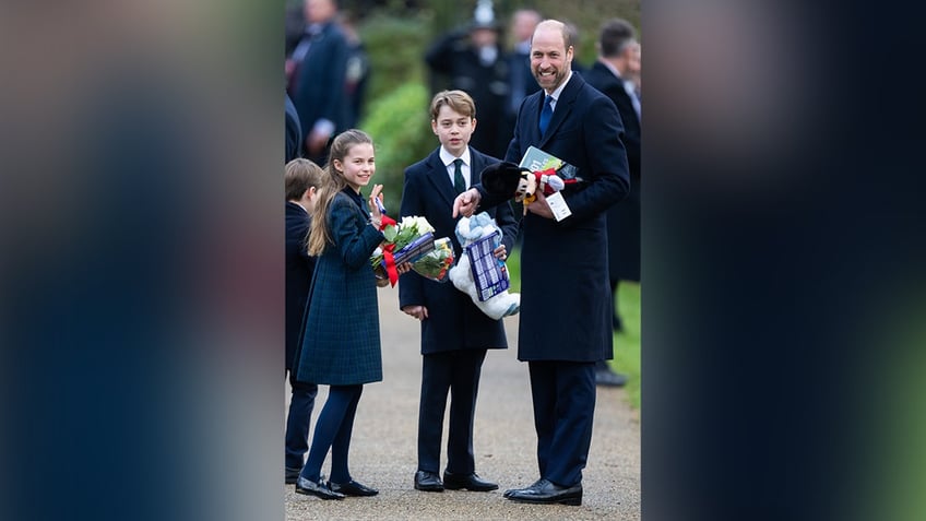 Princess Charlotte, Prince George and Prince William on Christmas morning.