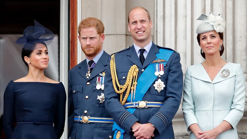 The Duke and Duchess of Sussex, along with the Prince and Princess of Wales, standing on the Buckingham Palace balcony in formal wear.