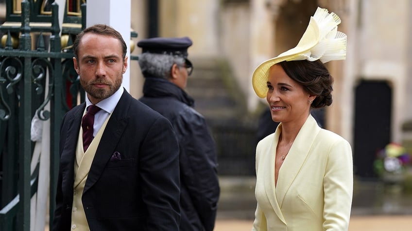 James Middleton walking next to Pippa Middleton in formal wear.