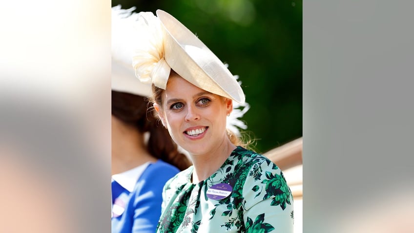 Princess Beatrice wearing a green floral dress and a fascinator