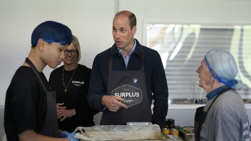 Prince William mingling with volunteers. 