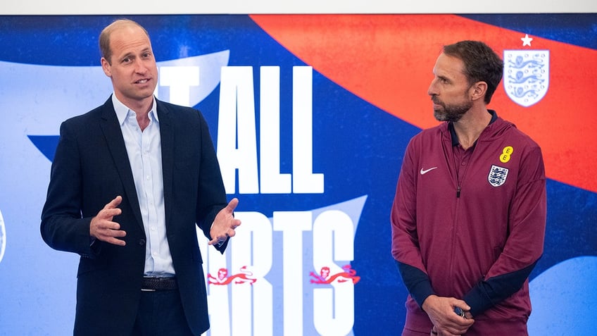 Prince William with a soccer player