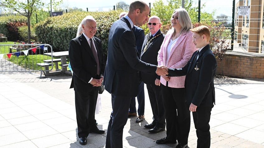 Prince William shaking Freddie's hand